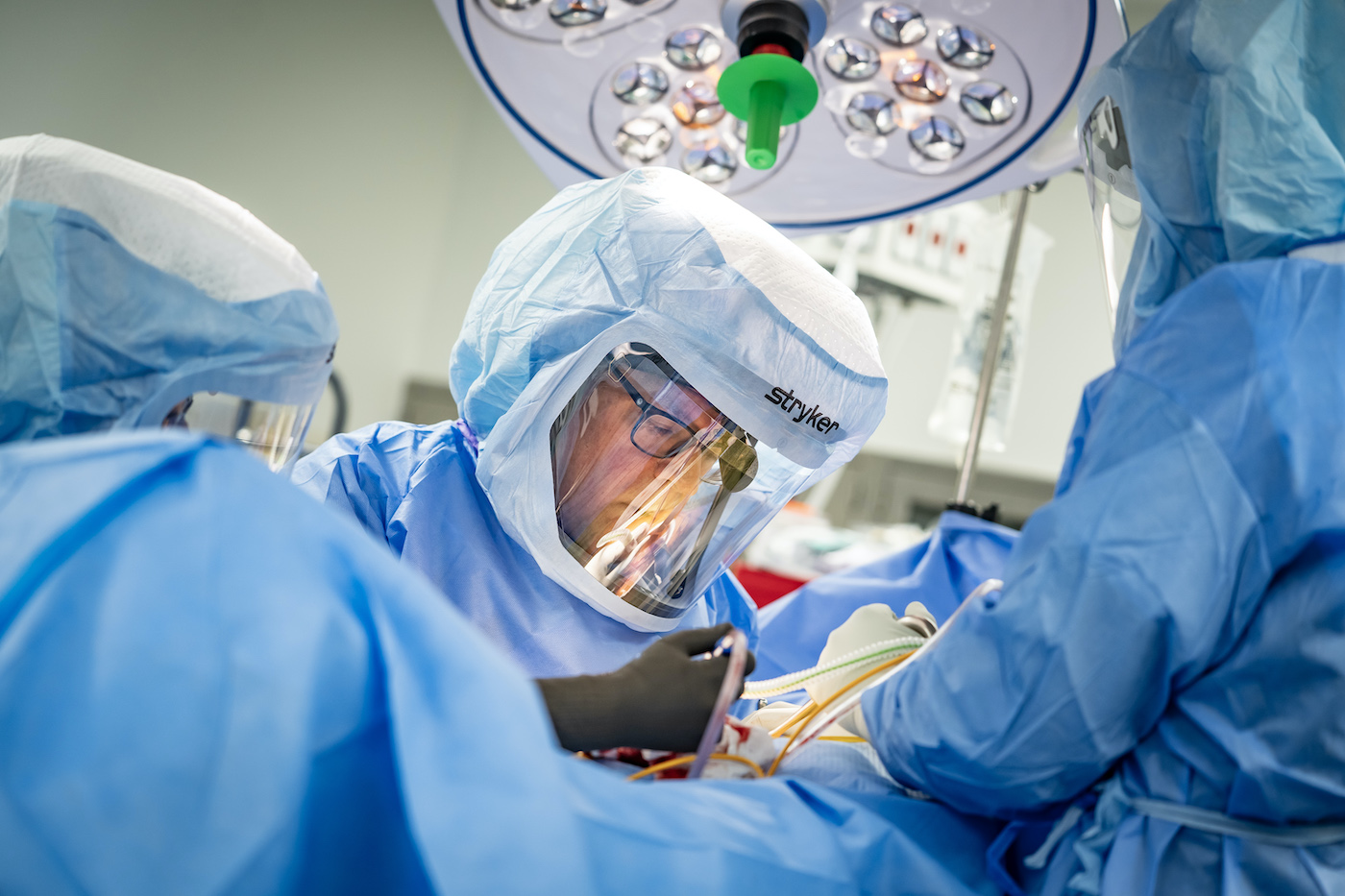 Surgeons working on a patient in an operating room