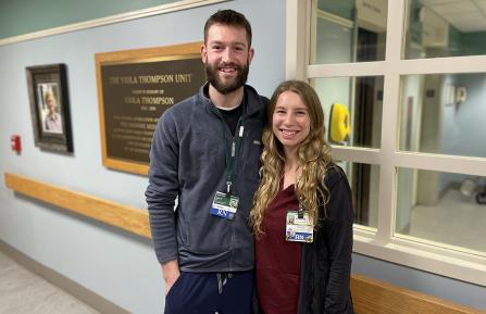 Mike West, RN, and Kylee West, RN stand outside Thompson Unit at Cheshire Medical Center where they met