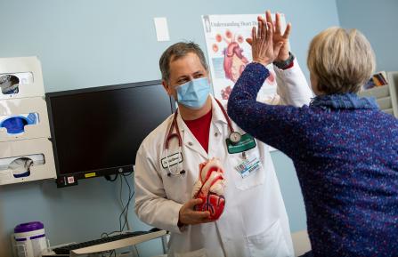 Doctor celebrates with patient