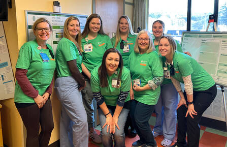 A group of nurses pose for a photo